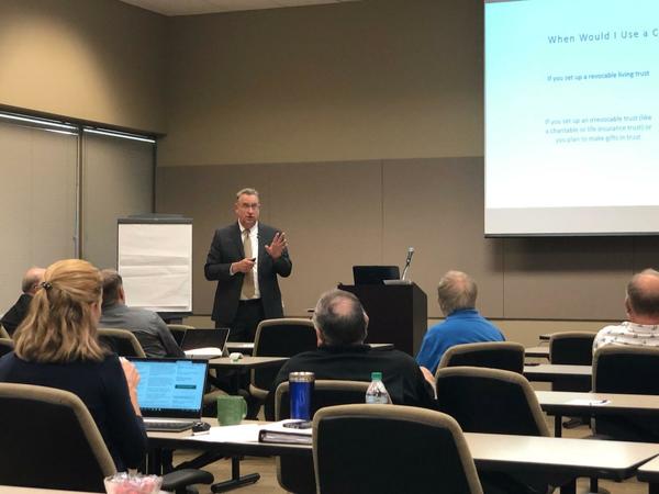 Greg Furseth speaks in front of a crowd at the Desert Willow Conference Center in Phoenix